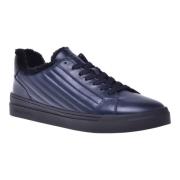 Trainers in dark blue quilted leather and leather